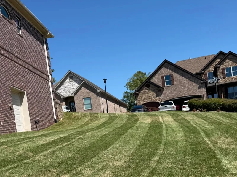 Perfectly manicured residential lawn after professional mowing with clean edges