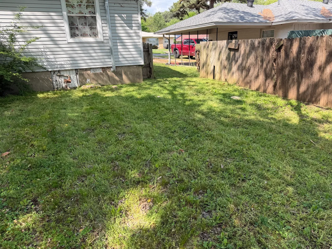 Immaculate commercial property lawn with perfect stripes and trimmed edges